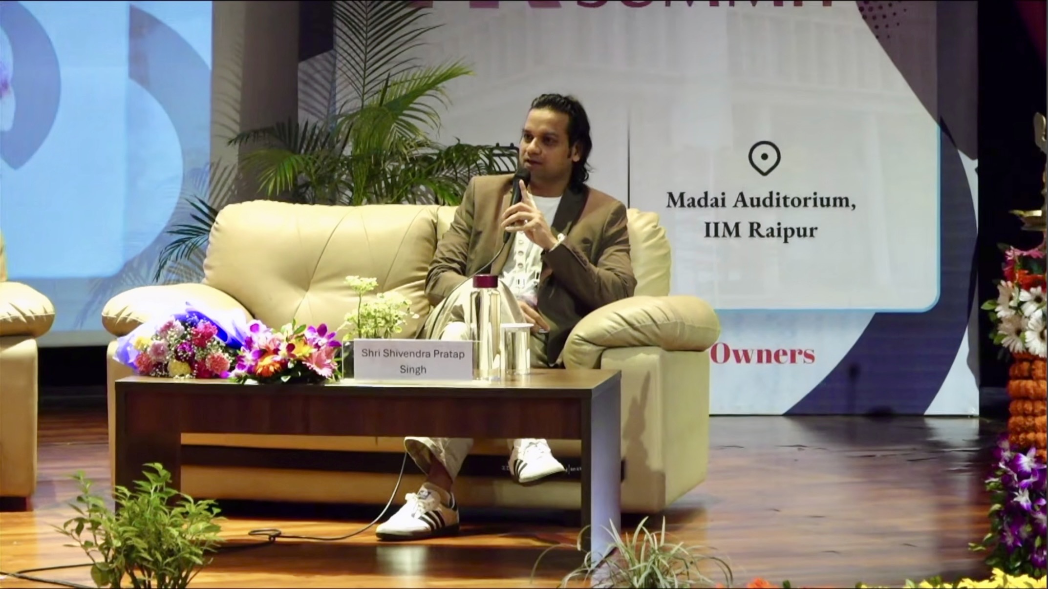 Shivendra speaking on stage at IIM Raipur